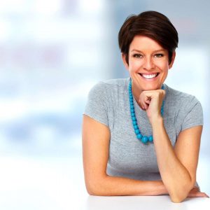 Smiling business woman is happy because she is charging high-ticket prices.